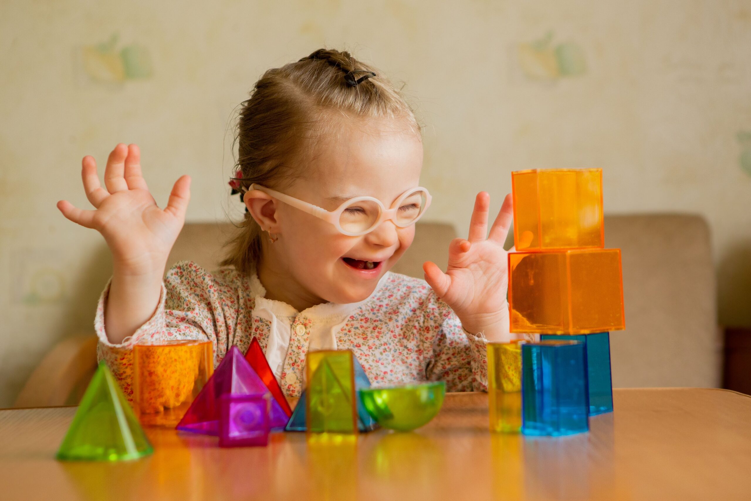 Child playing with therapy blocks during paediatric occupational therapy